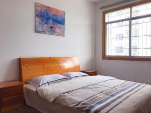 Postel nebo postele na pokoji v ubytování Taining Happy Stone Duplex Apartment