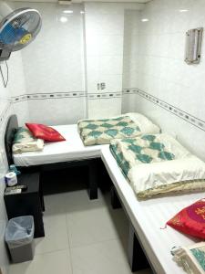 Un pat sau paturi într-o cameră la Philippine Hostel