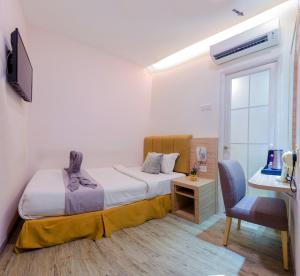 Ein Bett oder Betten in einem Zimmer der Unterkunft GM Grand Moments Bandar Sunway