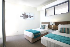 Letto o letti in una camera di Monaco Caloundra