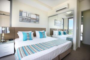 Letto o letti in una camera di Monaco Caloundra
