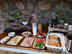 a table topped with different types of food at Lyhnos in Askas +12 photos