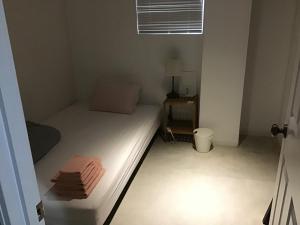 Ένα ή περισσότερα κρεβάτια σε δωμάτιο στο ラナイ ホテルアンドドミトリー +63 φωτογραφίες