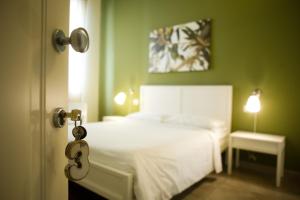 Postel nebo postele na pokoji v ubytování B&B Suite Paciotti