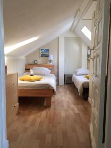 Кровать или кровати в номере Les Paridés