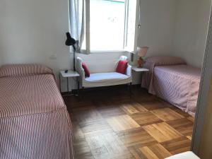 Łóżko lub łóżka w pokoju w obiekcie Magia nel golfo del Tigullio