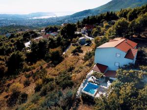 an aerial view of a house on a hill at Villa Valenta-Klis near Split, heated pool & view in Klis