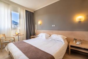 Postel nebo postele na pokoji v ubytování Nestos Hotel
