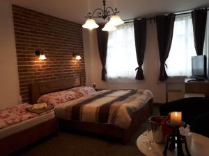 Postel nebo postele na pokoji v ubytování Penzion - Restaurant U Zámku