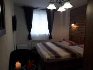 Postel nebo postele na pokoji v ubytování Penzion - Restaurant U Zámku