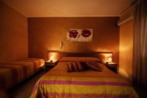 Postel nebo postele na pokoji v ubytování Hotel Venere