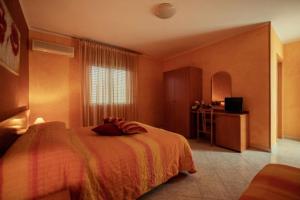 Postel nebo postele na pokoji v ubytování Hotel Venere