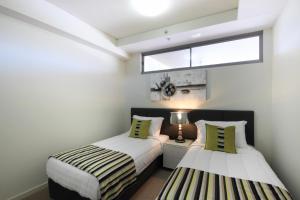 Letto o letti in una camera di Monaco Caloundra