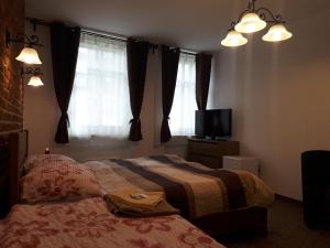 Postel nebo postele na pokoji v ubytování Penzion - Restaurant U Zámku