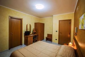 Postel nebo postele na pokoji v ubytování Hotel Venere