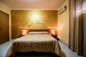 Postel nebo postele na pokoji v ubytování Hotel Venere