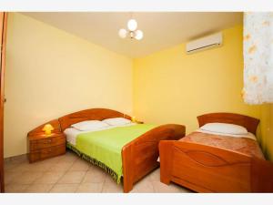 Postel nebo postele na pokoji v ubytování Apartmani Marica