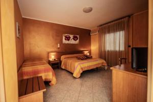 Postel nebo postele na pokoji v ubytování Hotel Venere