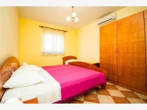 Postel nebo postele na pokoji v ubytování Apartmani Marica