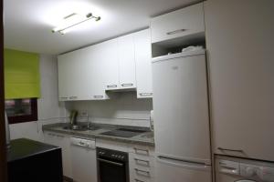 Kuchyň nebo kuchyňský kout v ubytování Residencial Cala Azul + 15 fotografií