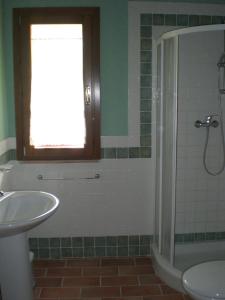 a bathroom with a sink and a shower at Agriturismo SANTA BARBARA in San Miniato