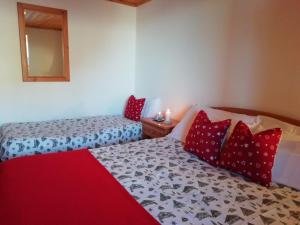 Ein Bett oder Betten in einem Zimmer der Unterkunft Albergo Riglarhaus