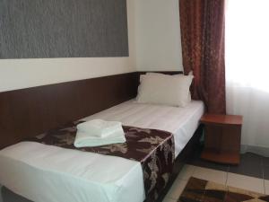 Postel nebo postele na pokoji v ubytování Hotel Tranzzit