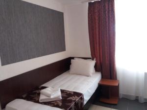 Postel nebo postele na pokoji v ubytování Hotel Tranzzit