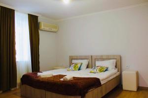 Postel nebo postele na pokoji v ubytování Nana's Home