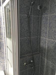 a shower in a bathroom with a glass door at Denia Playa I in Denia