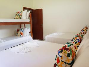 Rúm í herbergi á Condomínio RCR Green Field Casas para Temporada