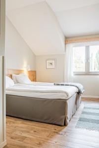 Postel nebo postele na pokoji v ubytování Storsätra Fjällhotell