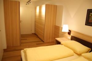 Llit o llits en una habitació de Ferienresidenz Leogangerhof