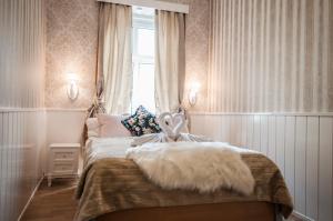 Postel nebo postele na pokoji v ubytování Urban Boutique Hotel
