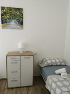 Katil atau katil-katil dalam bilik di Apartamentos Benidorm Chorrol