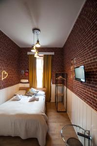 Postel nebo postele na pokoji v ubytování Urban Boutique Hotel