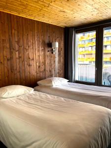 Un ou plusieurs lits dans un hébergement de l'établissement Alberta Hotel & Spa