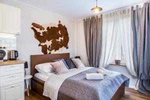 Posteľ alebo postele v izbe v ubytovaní Pałac Tatrzański Apartamenty
