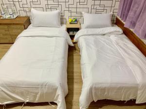 Postel nebo postele na pokoji v ubytování Fu Hwa Homestay