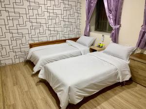 Postel nebo postele na pokoji v ubytování Fu Hwa Homestay