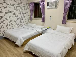 Postel nebo postele na pokoji v ubytování Fu Hwa Homestay