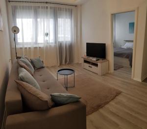 En TV eller et underholdningssystem på Apartments Spring