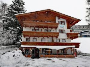 a large building with snow on it at Hotel Valerie in Saalbach Hinterglemm