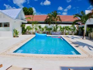 a swimming pool in the backyard of a house at So KohKoon Beach Resort in Bang Rak Beach