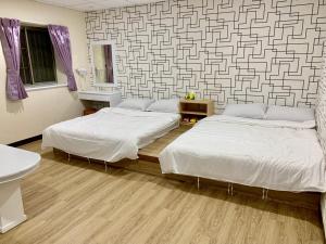 Postel nebo postele na pokoji v ubytování Fu Hwa Homestay