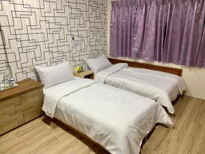 Postel nebo postele na pokoji v ubytování Fu Hwa Homestay