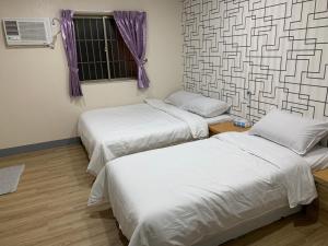 Postel nebo postele na pokoji v ubytování Fu Hwa Homestay