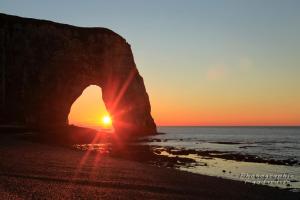 The sunrise or sunset as seen from a panziókat or nearby