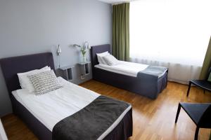 Postel nebo postele na pokoji v ubytování City Central Hotel Örebro by First Hotels