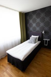 Postel nebo postele na pokoji v ubytování City Central Hotel Örebro by First Hotels